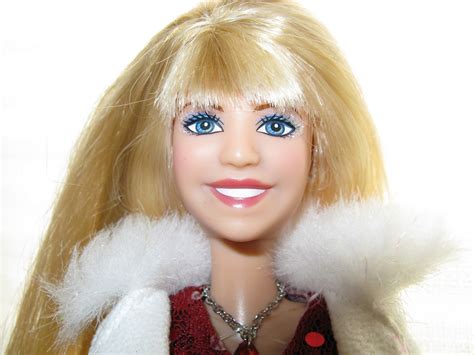 This is a beautiful Disney Barbie Doll of Miley Cyrus as Hannah Montana, released in 2007. The doll is made of vinyl with blue eyes and straight brown hair. Is an original, licensed Disney product. The doll is part of the Disney Barbie Dolls product line and is suitable for collectors and fans of Miley Cyrus. It is not an antique or vintage item and was manufactured between 2000-2009. The doll ... 
